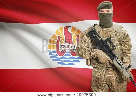 Soldier Holding Machine Gun With Flag On Background Series - French Polynesia