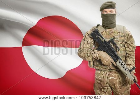 Soldier Holding Machine Gun With Flag On Background Series - Greenland