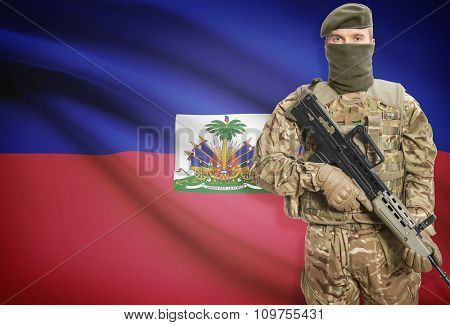 Soldier Holding Machine Gun With Flag On Background Series - Haiti