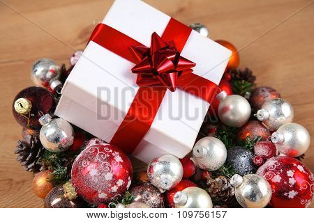 New Year gift on a golden tinsel background boly
