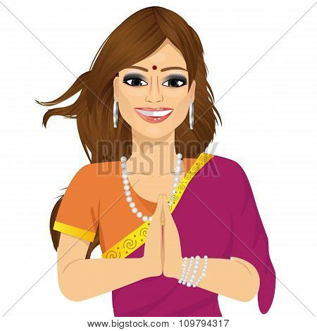 Traditional Indian woman holding hands in prayer position