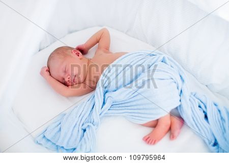 Cute Newborn Baby In White Bed
