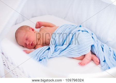 Cute Newborn Baby In White Bed