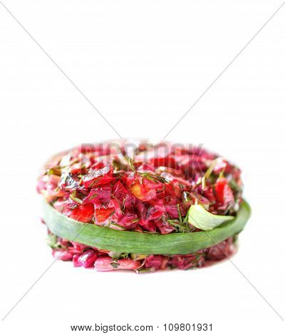Vegetarian salad of cooked beets with dill on white background.