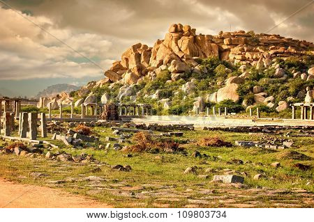Complex of Vittala Temple at sunset overcast sky Hampi Karnataka India.