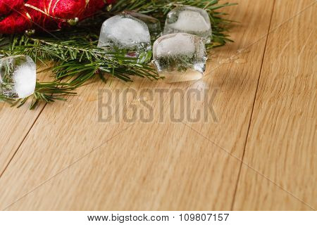 Meltel Ice On Oak Table Background