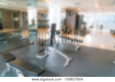 Abstract blur Fitness center with traineger equipments