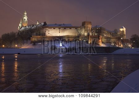 Poland, Krakow, Snow Covered Wawel Royal Castle Lit-up