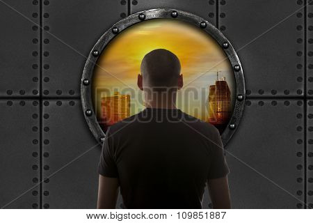 The man in the bunker looks at the city. Apocalypse concept