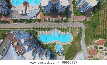 ALANIA - AUG 12, 2015: Pools near edifices of My Marine Residence hotel at summer sunny day. Aerial view videoframe