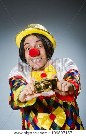 Funny clown against dark background