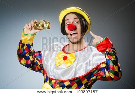 Funny clown against dark background
