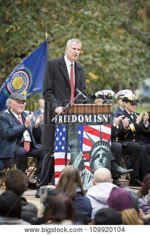 NEW YORK - NOVEMBER 11 2015: New York City Mayor Bill De Blasio speaks to the audience at the opening ceremony in Madison Square Park before the annual Americas Parade up 5th Avenue on Veterans Day.