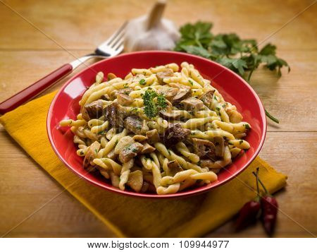 strozzapreti with mushroom, selective focus