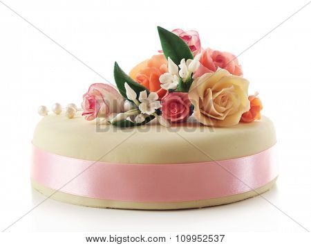 Cake with sugar paste flowers, isolated on white