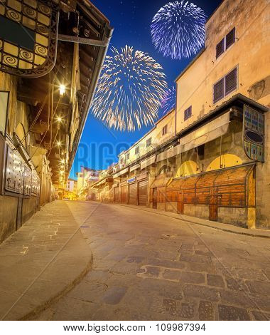 Beautiful fireworks above Arno River and Ponte Vecchio at sunset, Florence