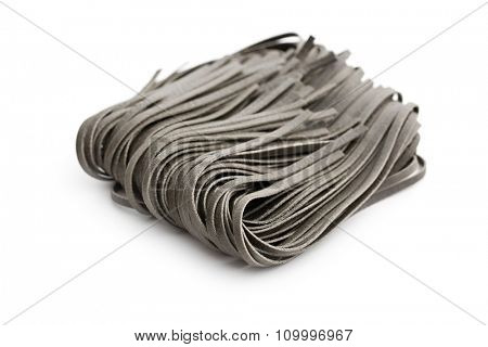 black noodles with squid sepia ink on white background