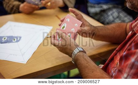 close up view of cards in hands