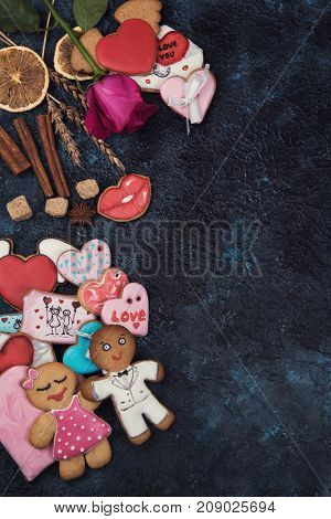 Gingerbreads for love or marrige on dark concrete background