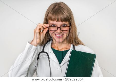 Portrait Of Successful Doctor With Stethoscope On White