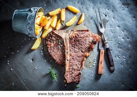 Yummy Tbone Steak And Chips With Salt And Rosemary