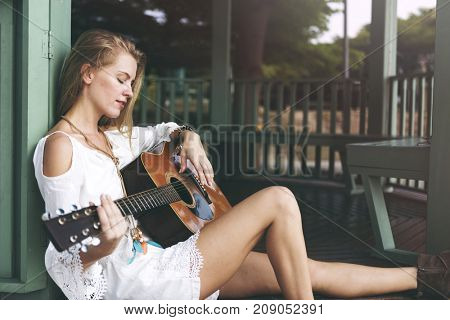 Beautiful singer songwriter with her guitar