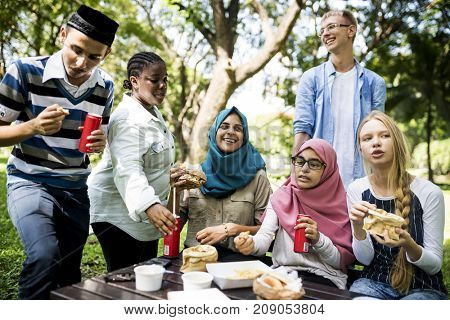 A group of diverse students are having lunch together