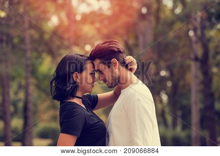 Young attractive couple in love enjoying in nature. Love concept.