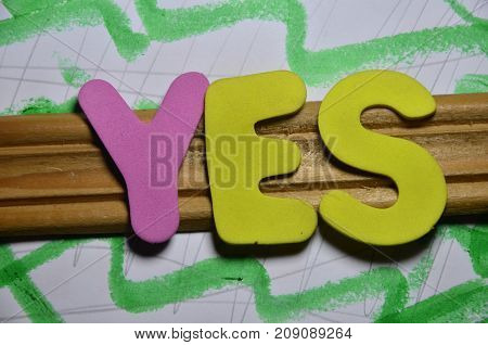 the word yes on a  abstract colorful background