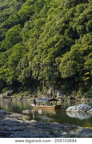 Kyoto, Japan - May 20, 2017: A wooden boat on the Katsura River at Otsuki, Yamanashi, Japan  