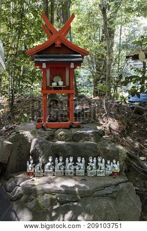 Kyoto, Japan - May 20, 2017: Traditional Kitsune, animal guardian in front of an Inari Shrine in Kyoto