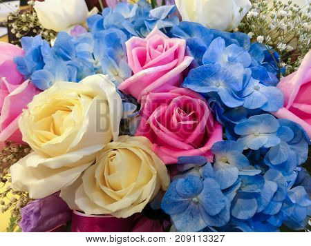 Colorful flowers arranged into bouquets. There are white roses Pink Roses and other flowers that are decorated for congratulatory ceremonies.