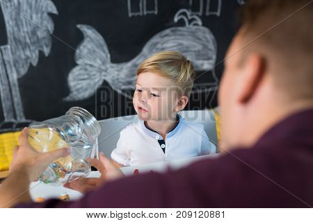 Cute little playfull toddler boy at child therapy session. Private one on one homeschooling with didactic aids.