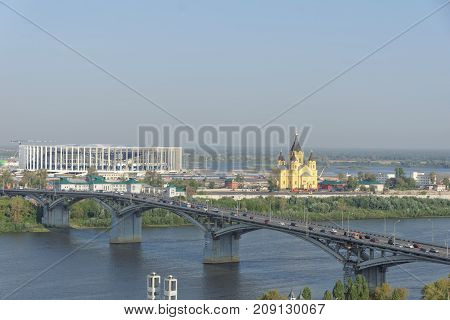 Nizhny Novgorod, Russia. - September 13.2017. View from the high bank of the Oka to the bridge across the Oka and the construction of a football stadium for the 2018 World Cup.