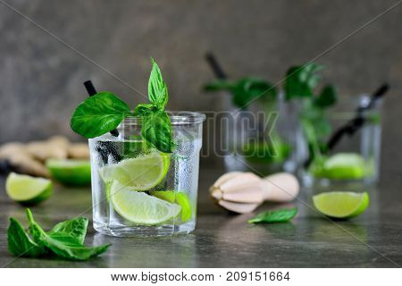 Basil limeade or alcohol cocktail in glasses front view
