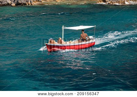CAPRI ITALY - JUNE 13 2017: Boats with tourists near Grotta Bianca and Grotta Meravigliosa Capri iATLY