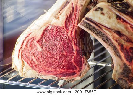 fresh meat of beef on a shelf in the fridge
