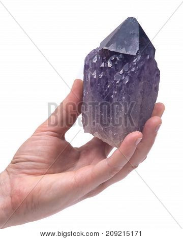 Woman's hand holding Ametrine lightbrary point from Bolivia isolated on white background