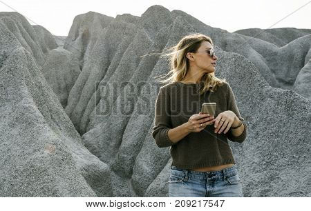 Woman hiking to the top of mountain in nature