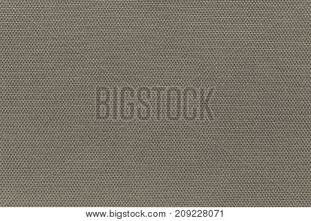 corrugated background and abstract wattled texture of fabric or textile material of beige color