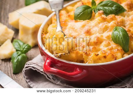 Mac and cheese, american style macaroni pasta in cheesy sauce