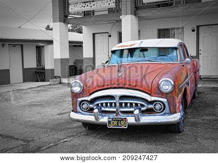 Seligman Arizona Usa - July 24 2017: Rusty abandoned Packard car in Seligman Arizona.