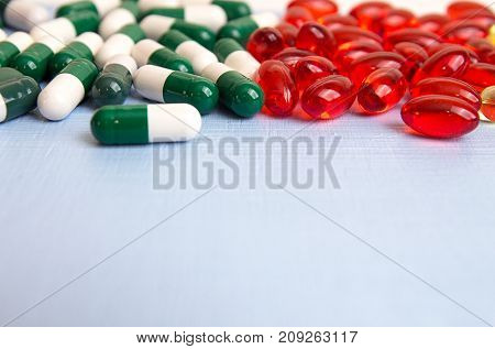 Pills Background. Heap Of Medicine Tablets And Pills In Blisters Different Colors On Blue Background