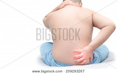Boy Holding His Back And Neck In Pain And