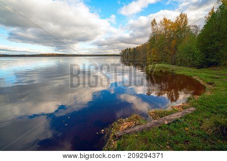White clouds over the lake in the fall.