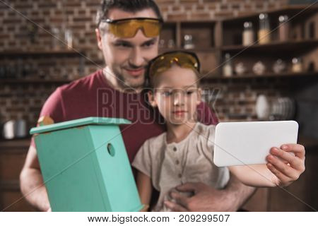 Father And Daughter Taking Selfie