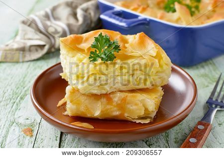 Cheese puff pie from unleavened dough. Georgian cuisine - khachapuri Achma