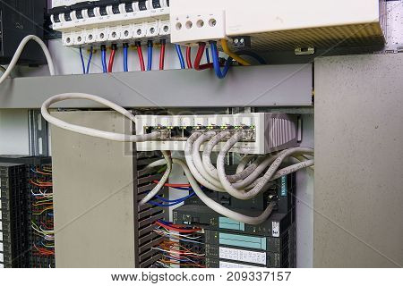 HUSTOPECE, CZECH REPUBLIC - APRIL 10, 2017: Image shows control cubicle. Schneider multimode fiber switch and Schneider circuit breakers inside power case.