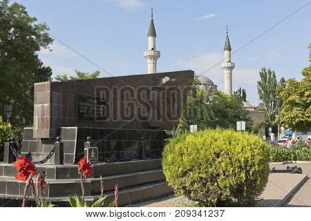 Evpatoria, Republic of Crimea, Russia - July 19, 2017: Monument to the heroes of the Yevpatoria landing and the Juma-Jami mosque in the city of Evpatoria