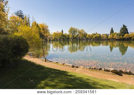 Autumn Colors And Reflection On The Puigcerda's Pond Water